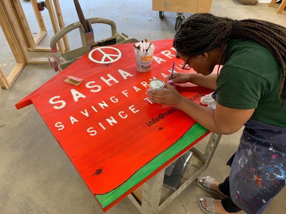 Brightmoor Makers student painting a sign